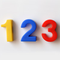 Drei Magnetzahlen sind nebeneinander zu sehen: eine gelbe 1, eine blaue 2 und eine rote 3.